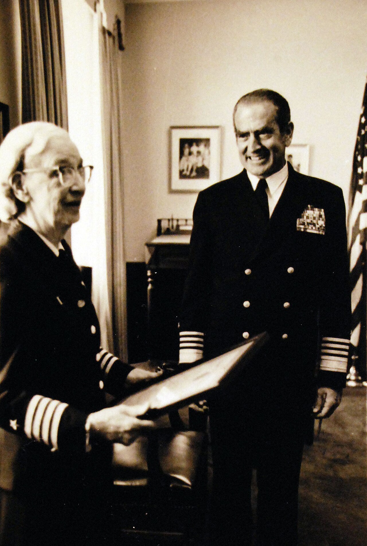 U.S. Navy Captain Grace Hopper receives her promotion certificate in an official service photograph.
